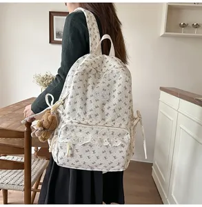 Cute corduroy bowknot school backpack for women, casual student rucksack with lovely lace trim.