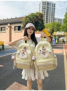 Sac à dos étudiant chiot dessin animé mignon avec bordure en dentelle et poche avant.