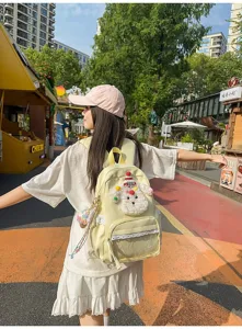Joli sac à dos chien de dessin animé avec bordure en dentelle et poche transparente.