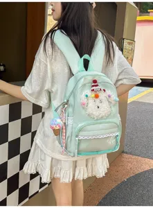 Joli sac à dos d'école vert menthe avec peluche de chiot duveteux, bordure en dentelle et poche avant.