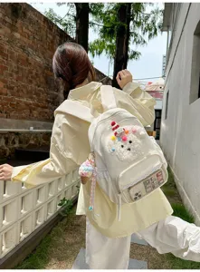 Adorable sac à dos d'écolier chiot cartoon avec bordure en dentelle et poche avant transparente.