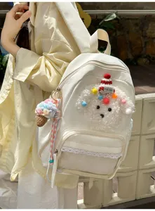 Joli sac à dos chiot de dessin animé avec bordure en dentelle et poche avant transparente.