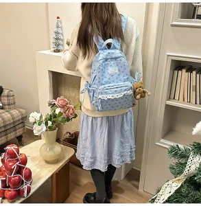 Light blue corduroy backpack with cute lace trim and bow, stylish student school bag.