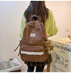 Brown corduroy backpack with cute lace trim, bow details and sweet style for daily use.