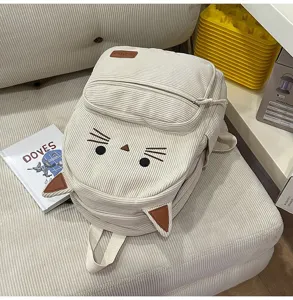 Corduroy cat backpack detail shot, showing cute embroidered whiskers and 3D ears, beige color.
