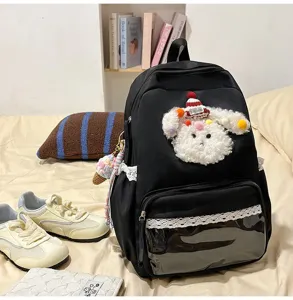 Sac à dos noir en toile avec adorable peluche de chiot duveteux et bordure en dentelle, transparent.