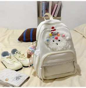 Adorable sac à dos chiot blanc de dessin animé avec dentelle, poche avant et pendentif.