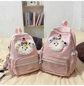 Joli sac à dos rose pour école avec design de chiot pelucheux et poche avant transparente.