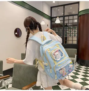 Cute sweet dopamine student backpack with transparent window and bow design for daily school use.
