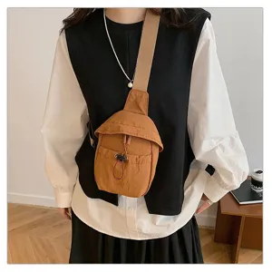 Casual outdoor canvas crossbody chest bag for men and women, lightweight retro sling backpack.