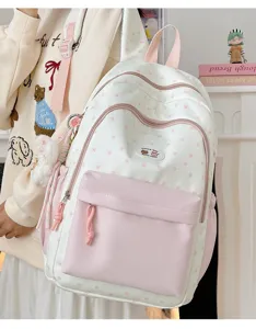 Cute pink star backpack detail shot showing front pocket, zippers, and sweet aesthetic design.