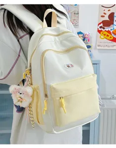 Cute color-block canvas backpack for girls, stylish school bag with star pattern, casual daypack.
