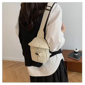 Detail view of lightweight canvas crossbody chest bag in beige, ideal for casual use.