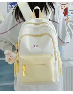 Cute color-block backpack with star patterns, front pocket, and lovely pendant for students.