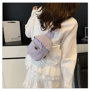Detail view of a light purple crossbody chest bag, casual outdoor style with drawstring design.