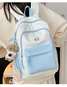 Cute star pattern colorblock backpack detail view, casual school bookbag for students.