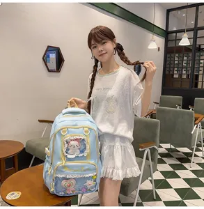 Cute light blue ita backpack with transparent front pocket, bow and cute plush for daily use.