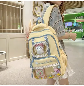 Cute dopamine style yellow ita backpack with clear window, bow, and cute plush toys inside for girls.