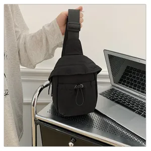 Black outdoor casual crossbody chest bag detail showing durable fabric and adjustable strap.