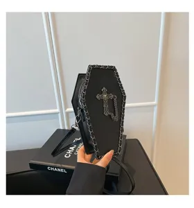 Gothic coffin shoulder bag detail shot featuring metal chain and cross decoration for dark style.