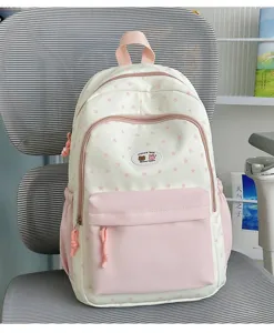 Cute pink star print backpack for women and girls, stylish casual school bookbag with pockets.