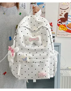 Sac a dos blanc a pois noirs avec jolies decorations en peluche pour tous les jours