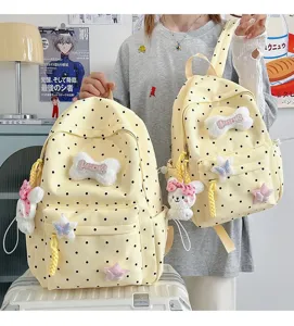 Joli sac à dos à pois de style japonais avec nœud en peluche et pendentif lapin pour l'école.