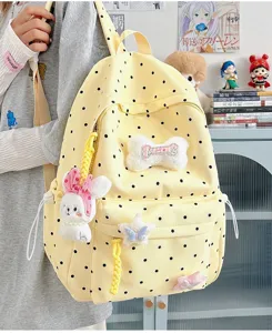 Joli sac à dos jaune à pois avec pendentifs en peluche style ins japonais pour étudiante.
