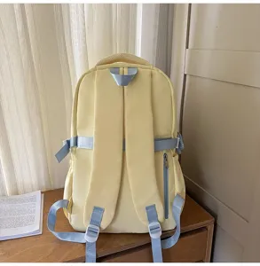 Casual yellow school backpack with blue straps, large capacity design for student.