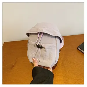 Lightweight outdoor crossbody chest bag with drawstring pocket for casual sports travel.