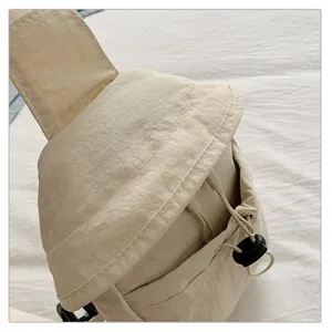 Lightweight casual crossbody chest bag for outdoor sports, minimalist design, beige fabric.