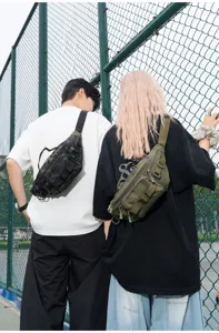 Outdoor tactical waist bag styled on models, showcasing versatile compartments and design.