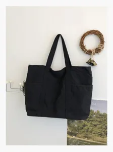 Detailed view of casual black nylon tote bag, daily commuting bag, simple style.