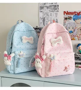 Sac à dos scolaire à pois style japonais ins avec pendentif lapin en peluche et jolis nœuds.
