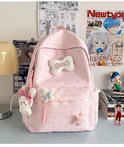 Sac à dos rose à pois kawaii avec charm lapin en peluche, joli cartable pour les filles.