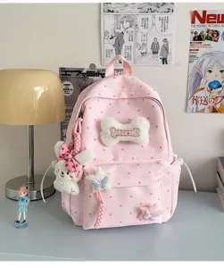 Sac à dos rose à pois style japonais mignon avec pendentif os en peluche pour étudiante.