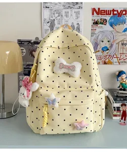 Joli sac à dos à pois de style japonais pour femmes et étudiants avec pendentif peluche mignon.