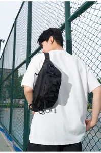 Outdoor tactical chest bag, multi-functional waist bag worn cross-body by male model.