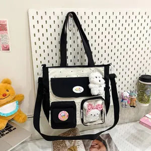 Detailed view of the black and white polka dot canvas crossbody bag details shown clearly