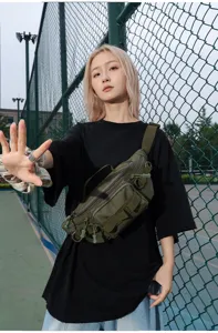 Detailed view of the multi-functional tactical waist bag with durable pockets and cross-body strap.