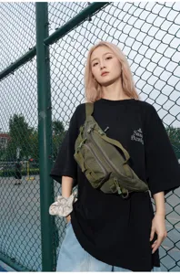 Multi-functional outdoor tactical waist bag, durable green crossbody chest bag for men and women daily use.