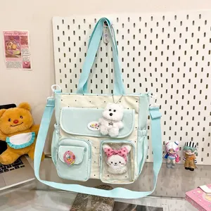 Cute polka dot canvas crossbody bag with multi-pockets, clear window and plush charms for daily use.