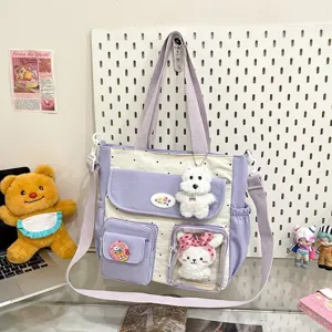 Cute polka dot canvas shoulder bag with multi-pockets and plush pendants for women