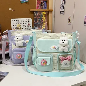 Canvas crossbody shoulder bag with cute plush dog rabbit charms, multi-pocket aesthetic.