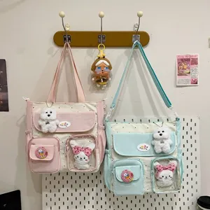 Cute polka dot canvas tote bag, large capacity shoulder crossbody bag with cute plush toys.