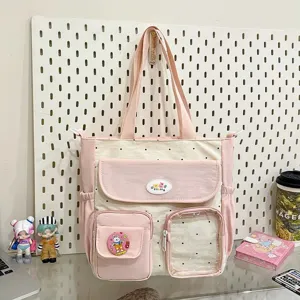 Cute polka dot canvas shoulder bag with multi pockets, lightweight and spacious design.