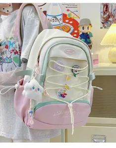 Zaino stile giapponese carino per ragazze grande capacità design rosa e bianco con ciondolo.