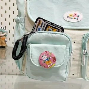 Detailed view of the cute two-tone casual backpack with multiple pockets and fun pins.