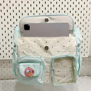 Close-up view of the cute polka dot shoulder bag showing large capacity and multi-pocket design.