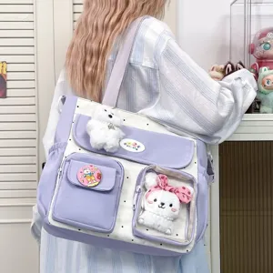 Cute polka dot canvas shoulder bag with plush bear and bunny charms, large capacity design.